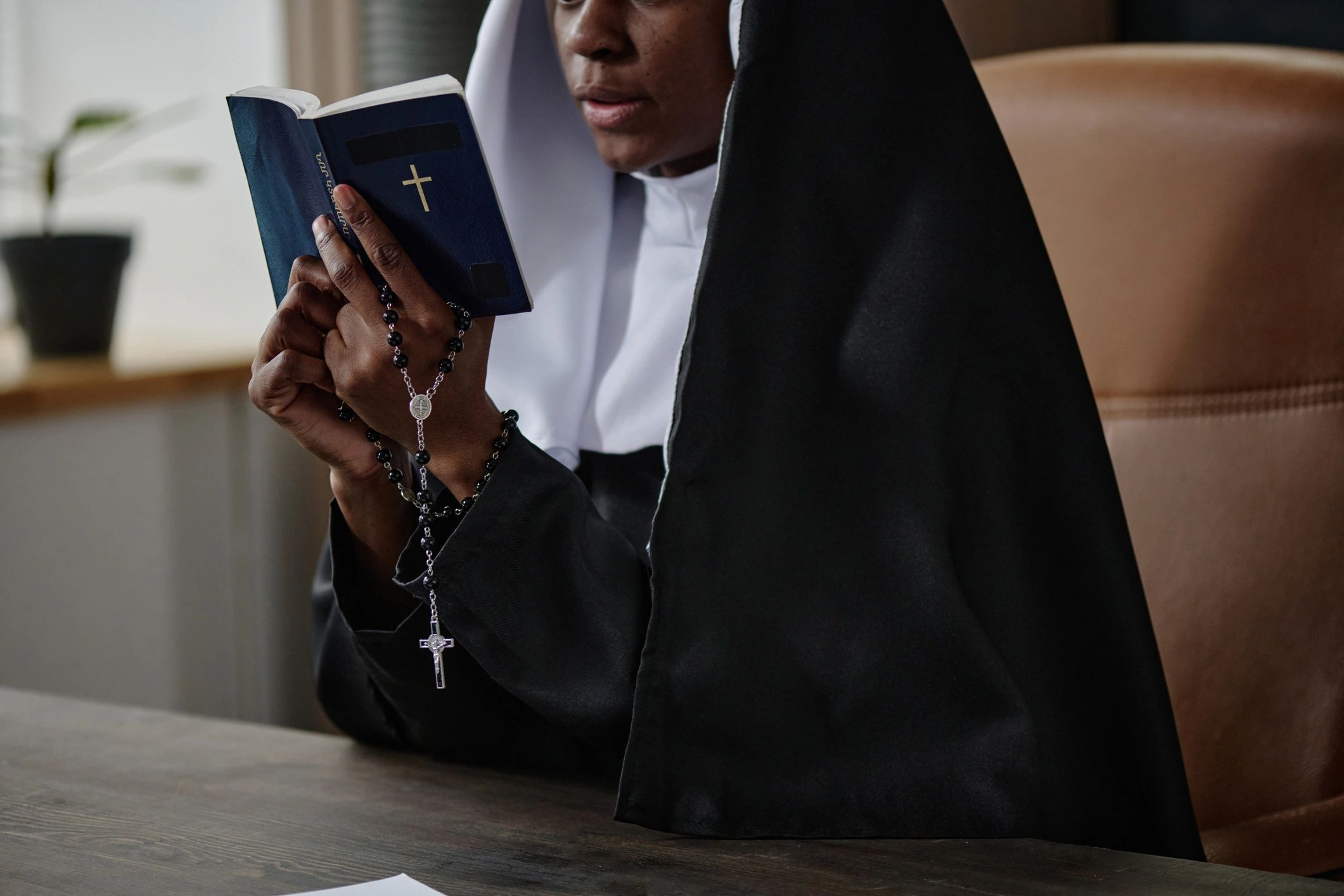 Church leader reading the Bible in an office