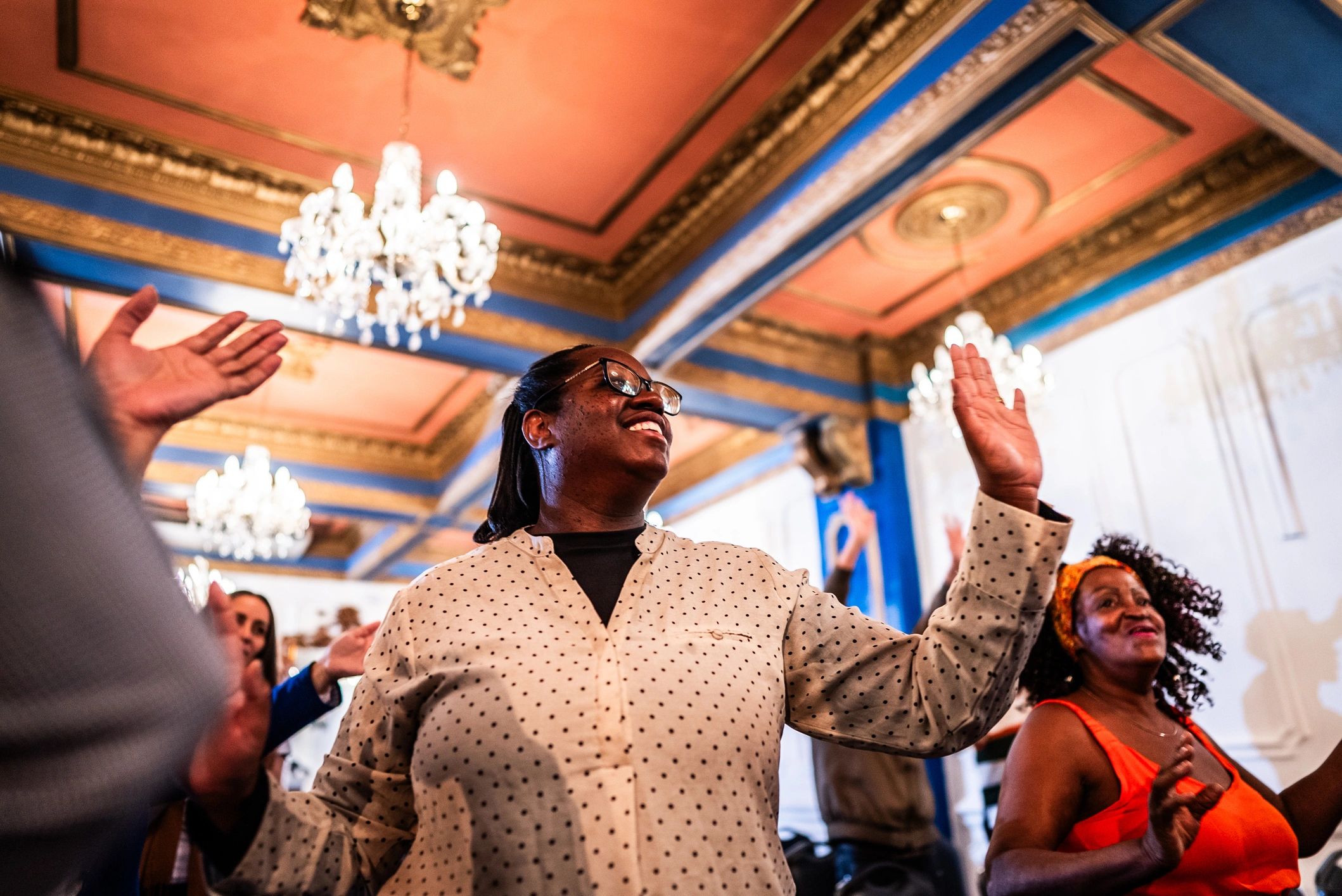 Woman praising during church worship service