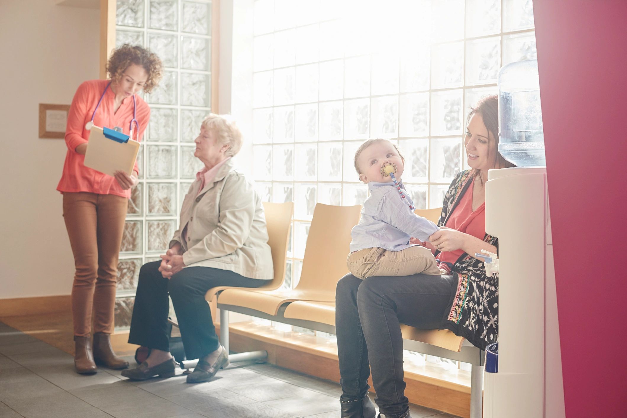 Parent and child together in a welcoming lobby
